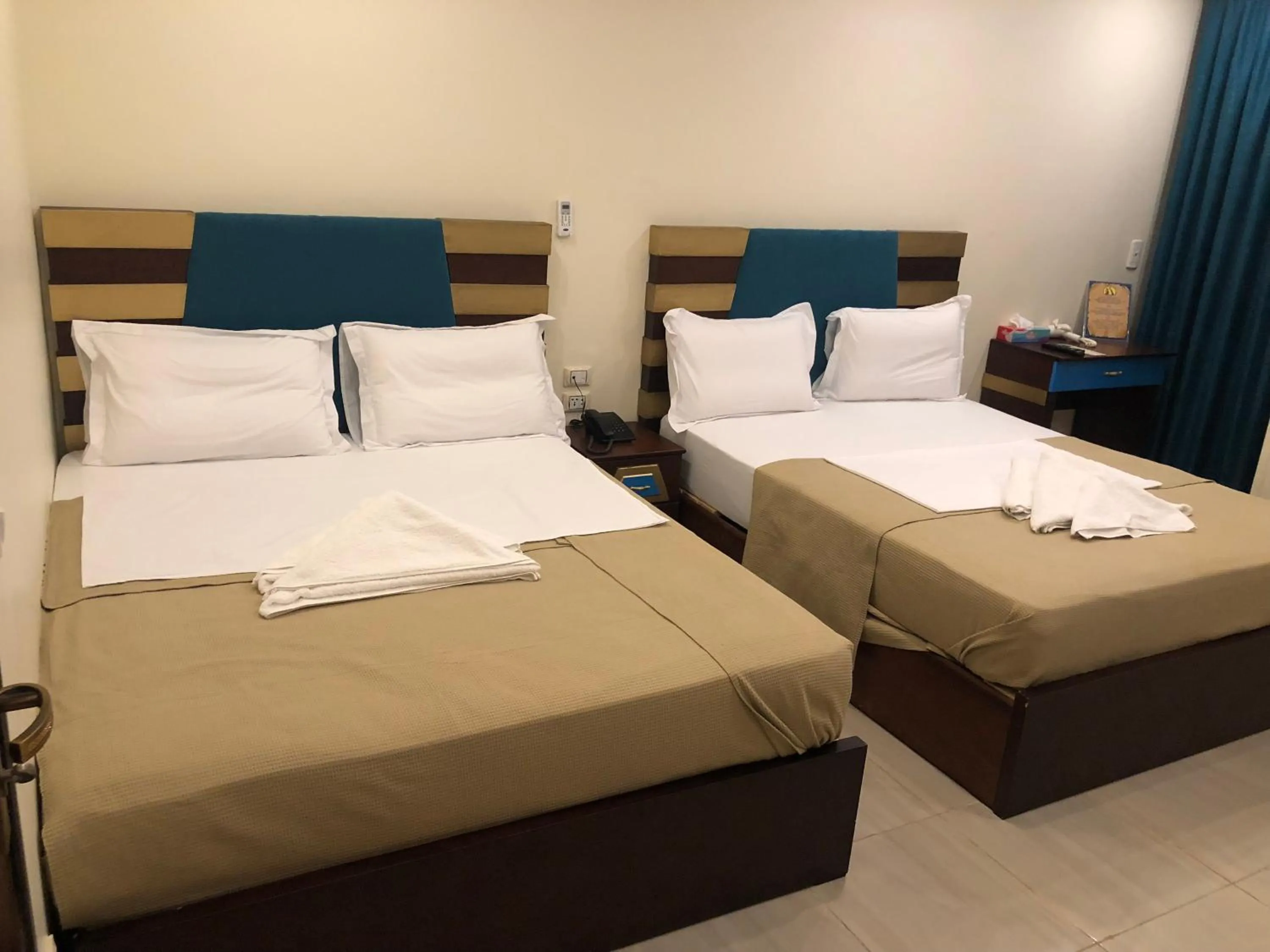 Photo of the whole room, Bed in Great Pyramid Inn