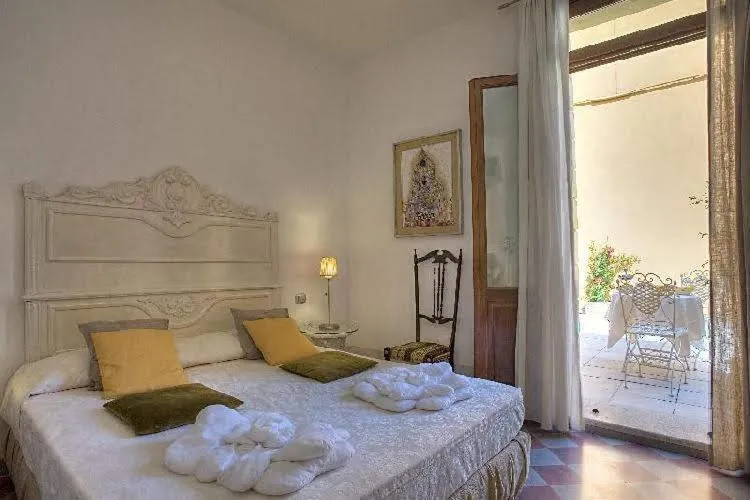 Bed in Art Hotel Al Fagiano