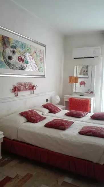 Bed in Art Hotel Al Fagiano