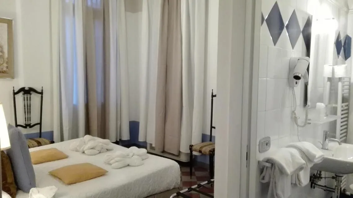 Bed in Art Hotel Al Fagiano