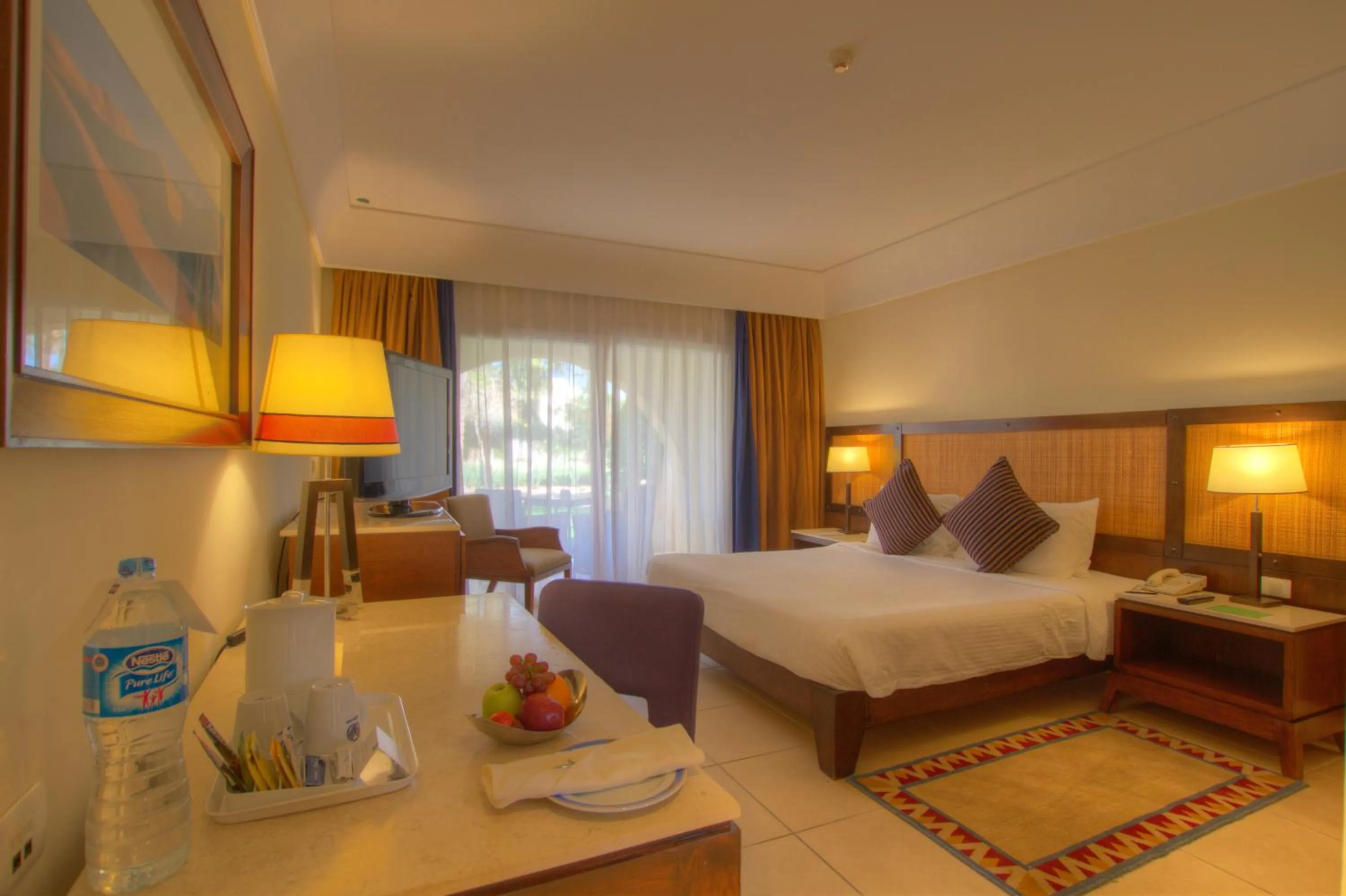 Pool view, Bed in Grand Rotana Resort & Spa