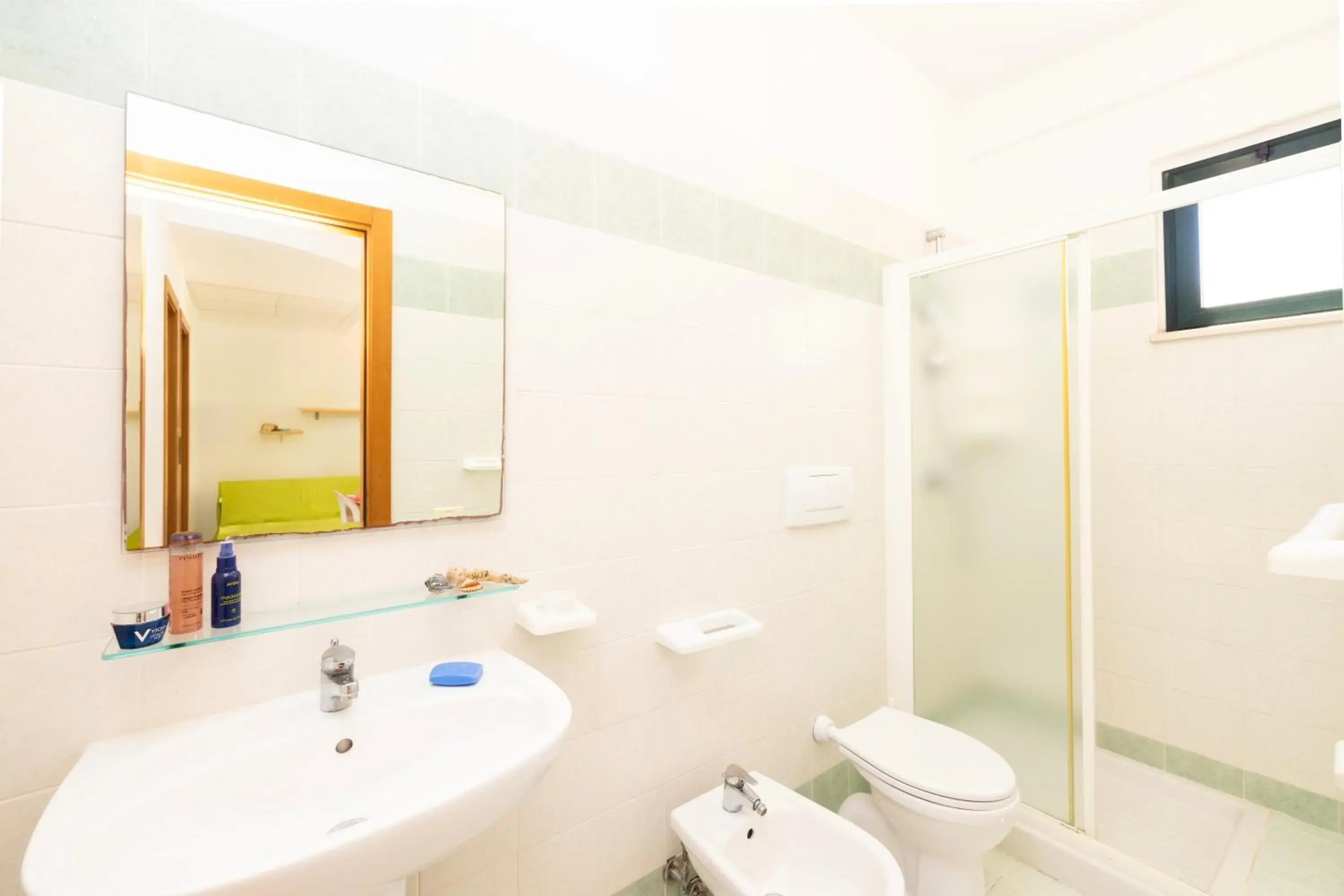 Bathroom in Baia Degli Aranci Suite & Apartments Bathroom in Baia Degli Aranci Suite & Apartments