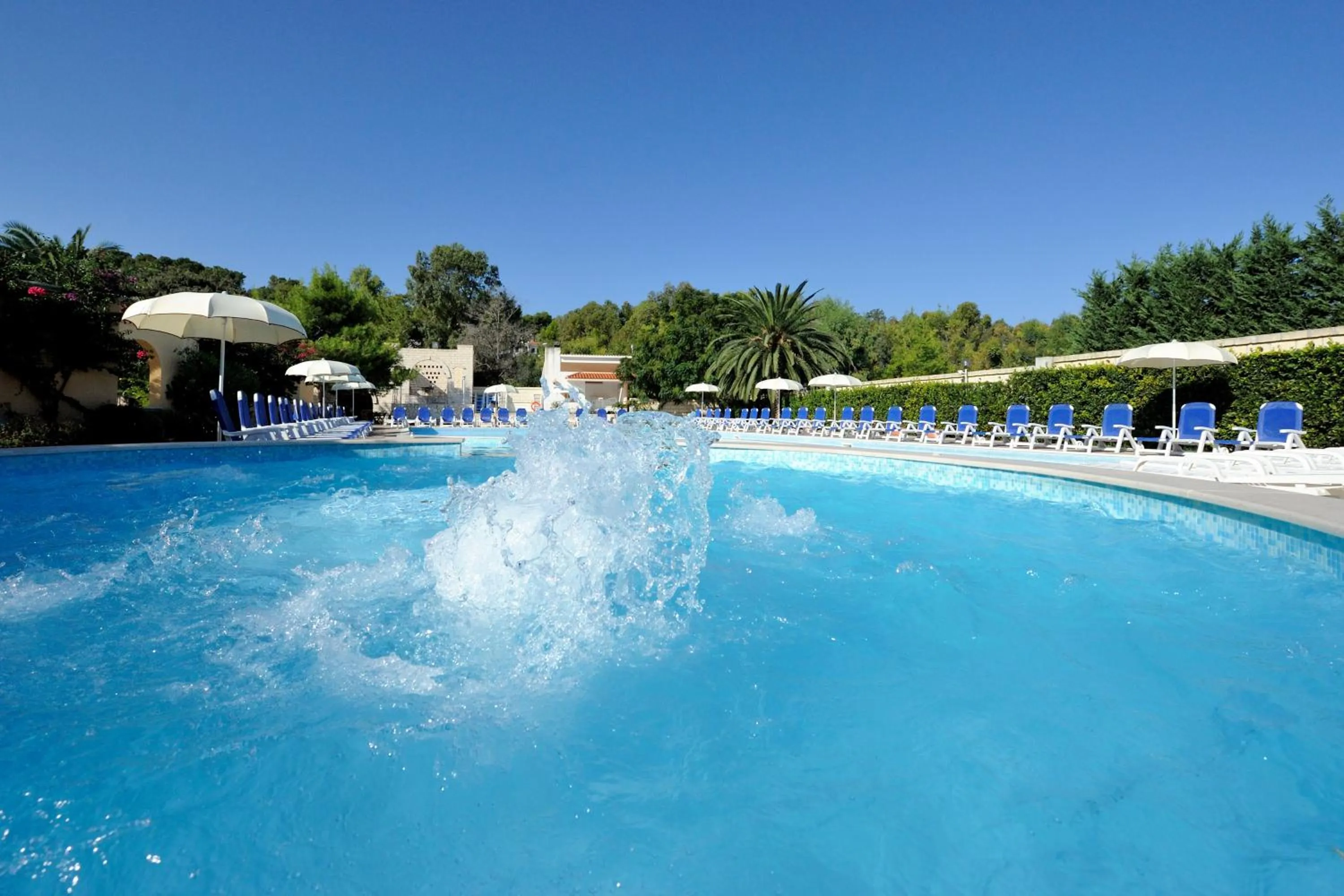 Swimming pool in Baia Degli Aranci Suite & Apartments