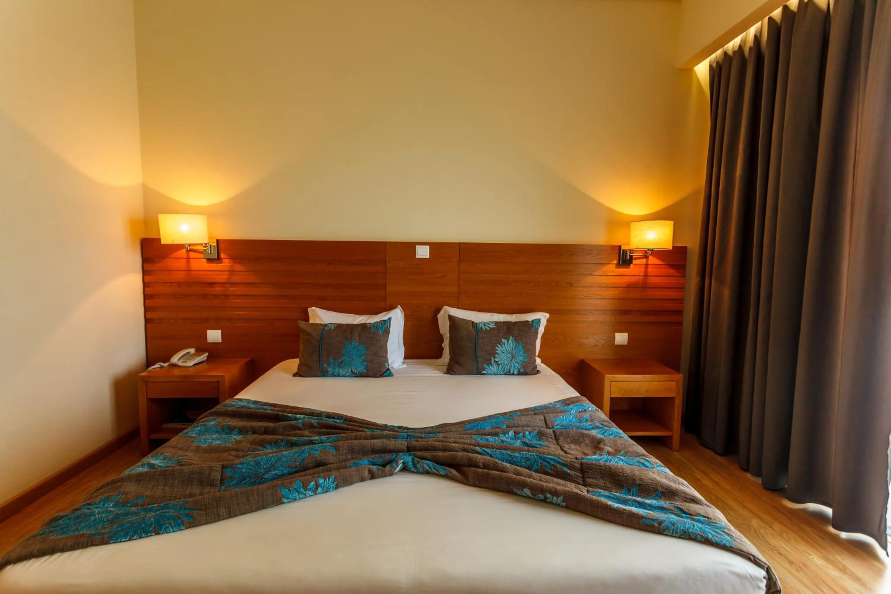 Bed in Hotel Caravelas